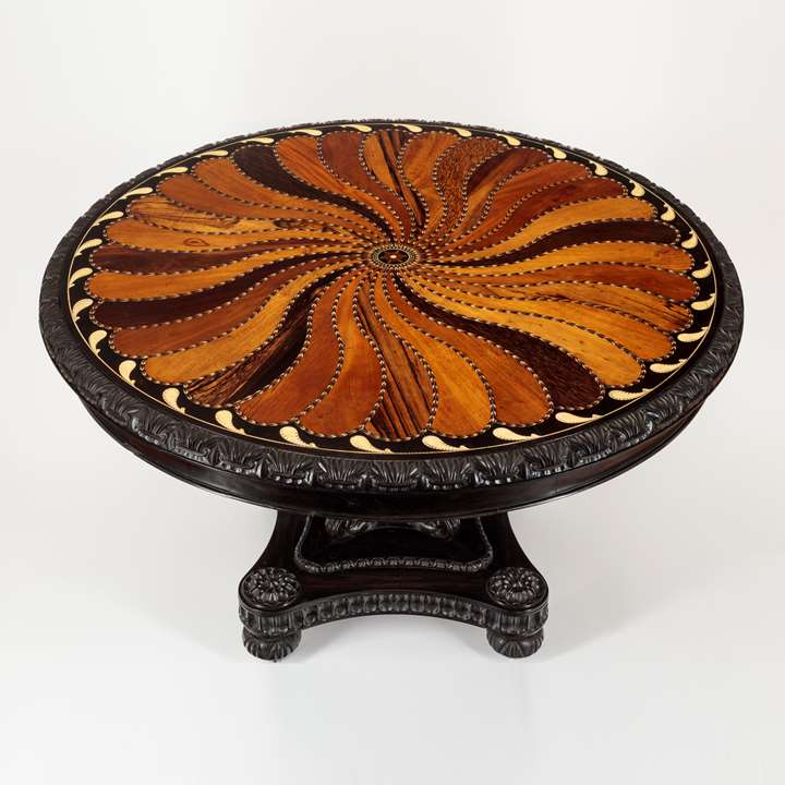 A large Ceylonese Ebony and Specimen Wood Centre Table